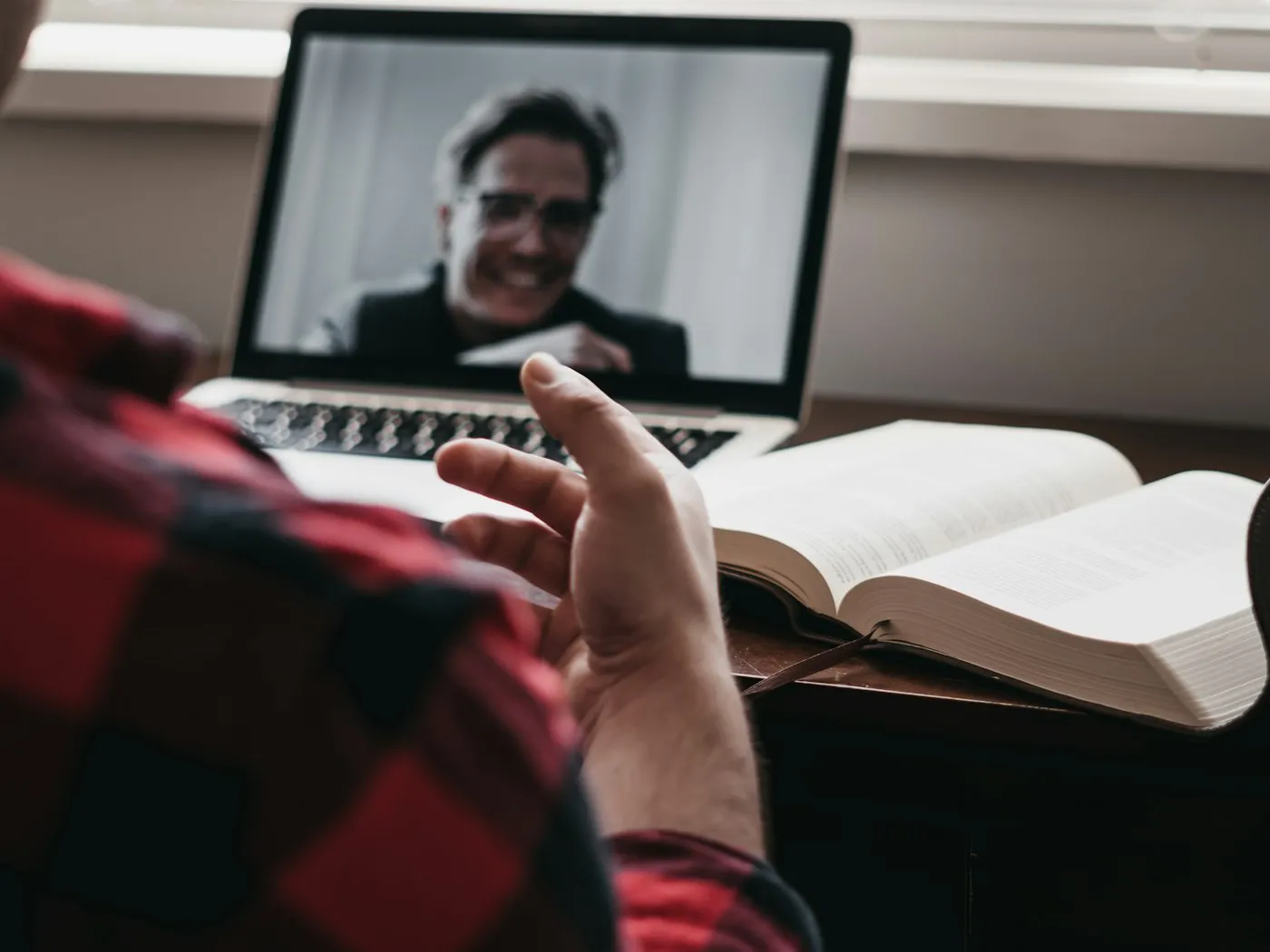 Over-the-shoulder view of a client on a video strategy call